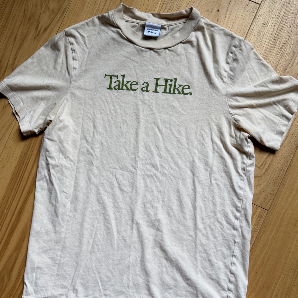Outdoor Voices Cream Tee with Green "Take a Hike." Logo